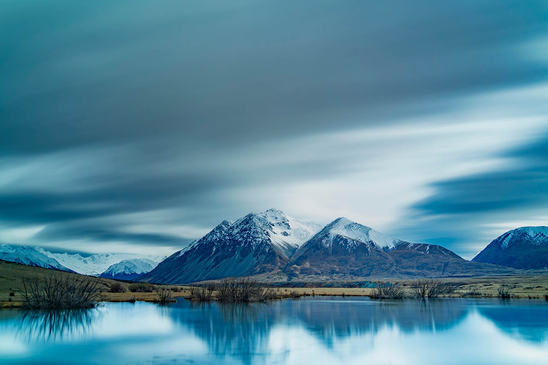Ghosts - dramatic long exposure Ahuriri Valley landscape with ghostly black swans, snow-capped peaks reflected in turquoise lake, South Island New Zealand by Steve Couper Photography