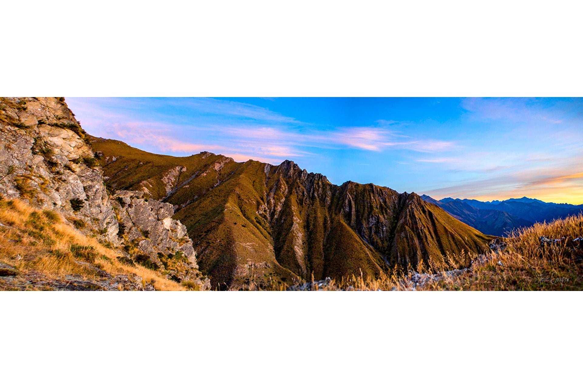 Dramatic ridges and alpine tussock plunging into stunning Lake Hawea at Glen Dene Station, prime rugged habitat for agile Chamois in New Zealand's South Island